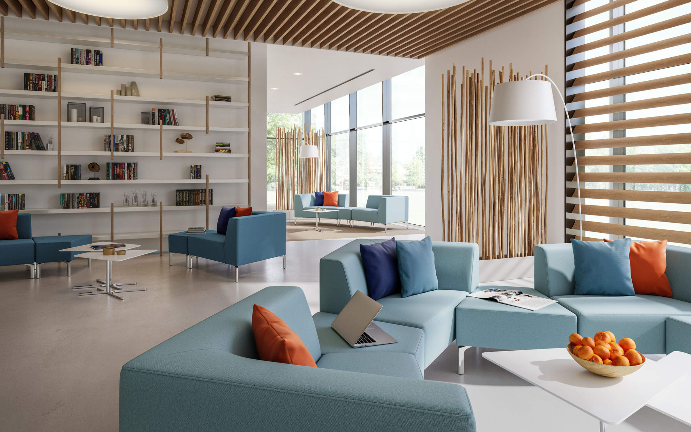 Et åbent designet afslapningsområde med forskelligt placerede Tangram-sofaer i blå og med Tangram-borde i hvid.